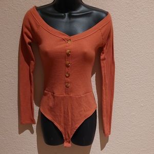 Orange long sleeve bodysuit
